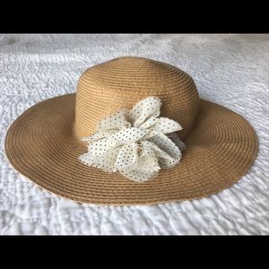 Classic sun hat; sweet polka dot flower detail.